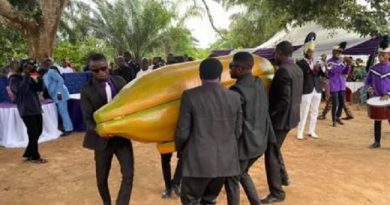 Lady Buries Father In A Gold Plated Pawpaw Shaped Coffin In Akwa Ibom